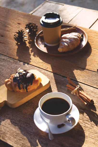 istock Coffee cup hot on wooden table in the morning background 1740892438