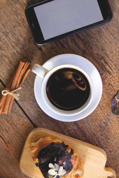 istock Coffee cup hot on wooden table in the morning background 1740892459