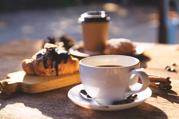 istock Coffee cup hot on wooden table in the morning background 1740892480