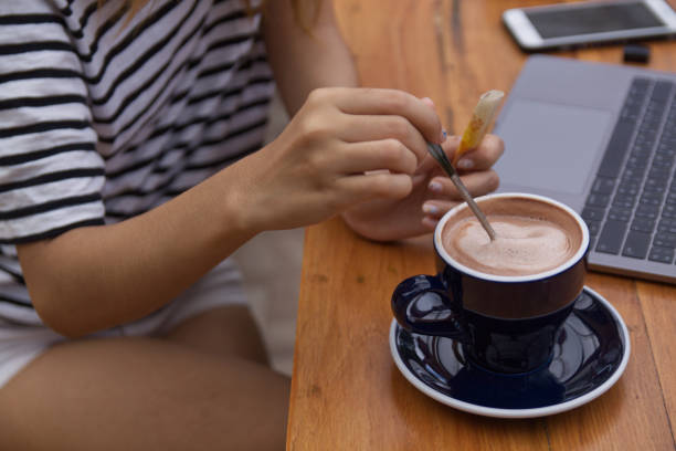 istock Women using laptop working and drinking coffee cup hot in the morning background 1740893071