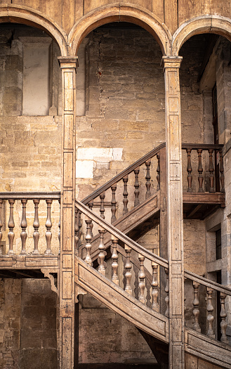 Old medieval wooden staircase of a bourgeois house in Dijon, Burgundy, France