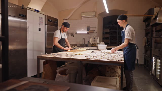 Caucasian Artisan Bakers Working In A Small Bakery