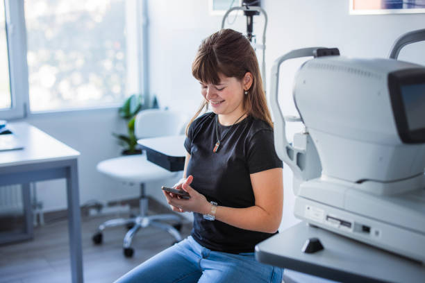 istock Girl sitting at doctor's office and using smart phone 1740907114