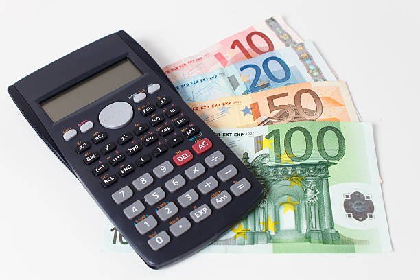 Calculator with Euro Bank Notes stock photo