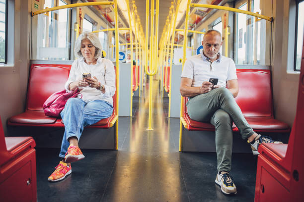 istock Man and woman riding in a train 1740919365