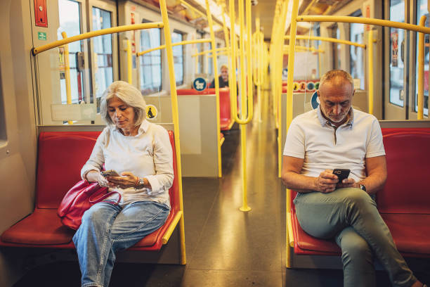 istock Man and woman riding in a train 1740919976