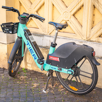 Rome, Italy - February 15, 2023: Electric Rental Bikes Scattered Around The Rome Sidewalks