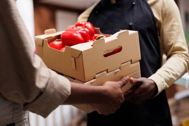 istock Black man selling fresh organic produce 1740938253