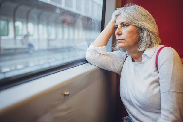 istock Woman riding in public train 1740939425