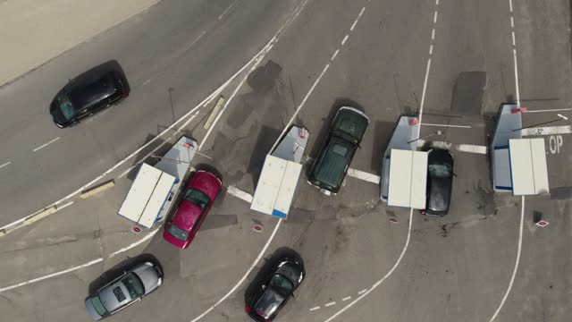 Top view of cars passing through the parking barriers. Vehicle Park Barrier Systems, Speed Gate, Automatic Security Barrier at Parking, Toll Road Turnpike, Entry Fee Pay Gate.