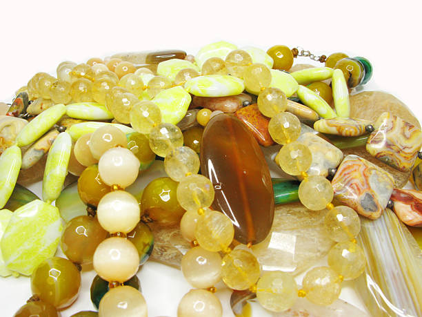 istock heap of yellow colored beads 174094233