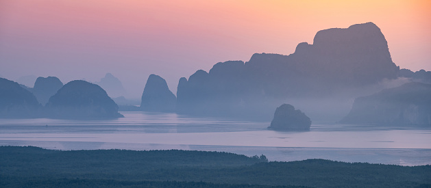 Panoramic view of Phang Nga Bay during sunrise. View from Samed Nang Chee or Samat Nangshe viewpoint, one of travel destinations in Phang Nga Province, Thailand.