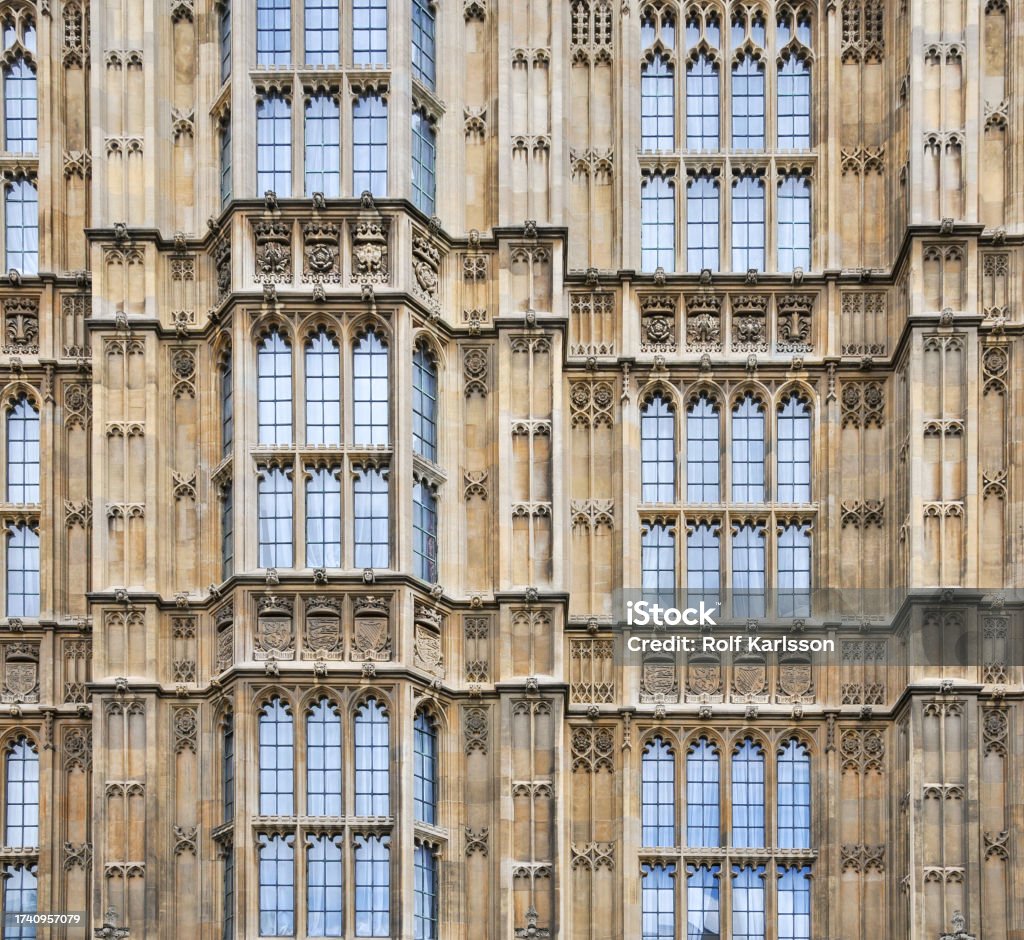 The Houses of Parliament in London, a classic exemple of British Gothic architecture, showcasing intricate details on the exterior faÃ§ade of the UK's seat of government. In London, the Houses of Parliament stand as a quintessential example of British Gothic architecture, with their exterior faÃ§ade offering intricate details that characterize the UK's government seat. Architecture Stock Photo