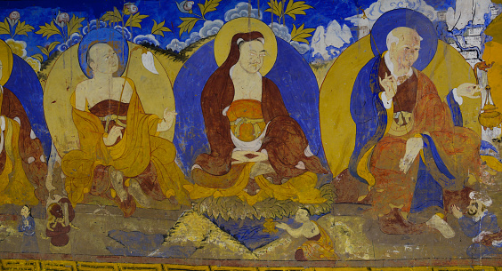 God painting on wall of ancient Tibetan monastery in Leh, India.