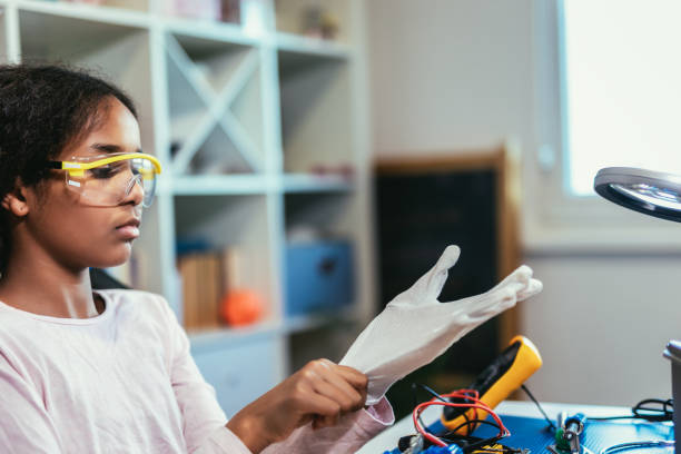 istock Girl is Working on a Robot in Her Room. Education Concept. 1740976179