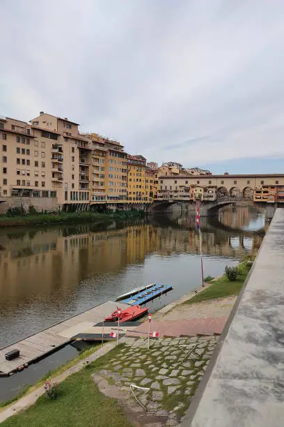 Photo of Ponte Vecchio bridge in Florence, Italy. Arno River. Tuscany