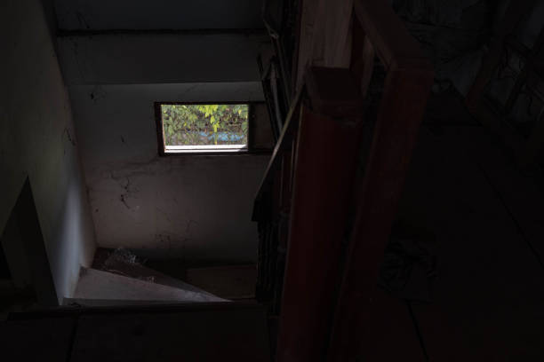 istock old window in house Built next to a cement staircase And there was still a soft light passing through. 1740999831
