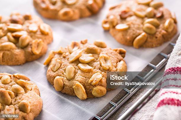 A Close Up Photograph Of Some Peanut Chip Cookies Stock Photo - Download Image Now - Bakeware, Cooling Rack, Peanut - Food