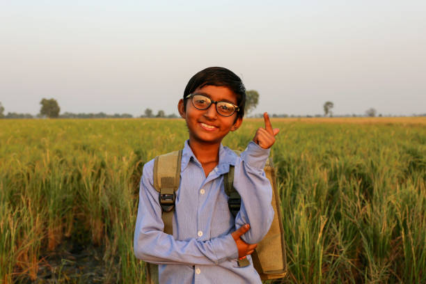 istock Creative child thoughtful standing portrait near green field 1741028436