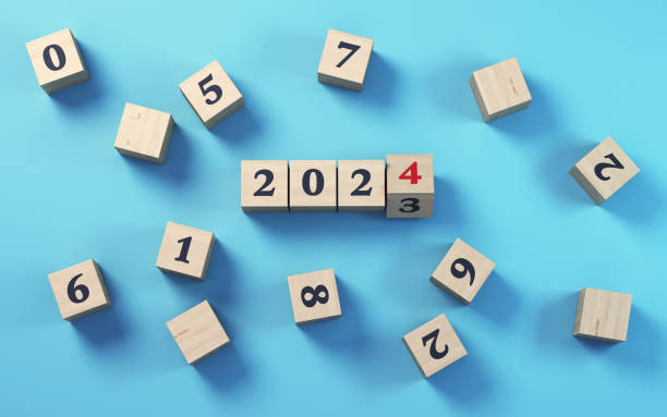 istock New Year 2024 Written on Wooden Block Sitting on Blue Background 1741038063