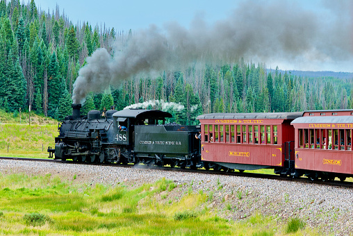 Antonito, Colorado, USA - July 22, 2023: The Cumbres & Toltec Scenic Railroad steam train travels from Antonito, Colorado, to Chama, New Mexico on a summer day.