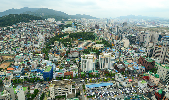 Busan, South Korea - Sep 18, 2016. Aerial view of downtown on coast in Busan, S. Korea. Beautiful scenery from Busan Tower in rainy day.