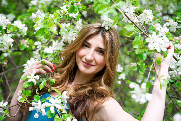 istock Beautiful woman in spring park 174104439