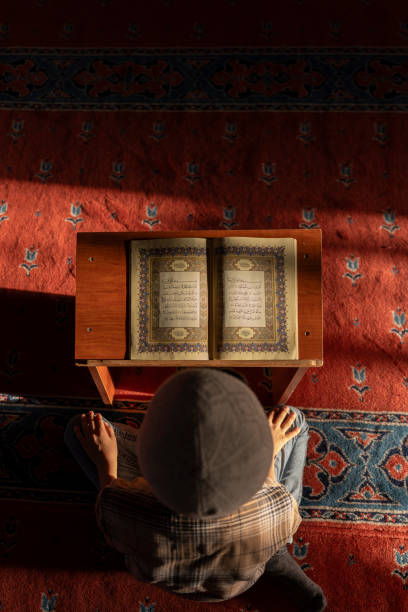 istock A boy reading the Qur'an in a mosque. 1741047142