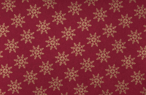 istock Elegant golden snowflakes on a festive red background 1741048307