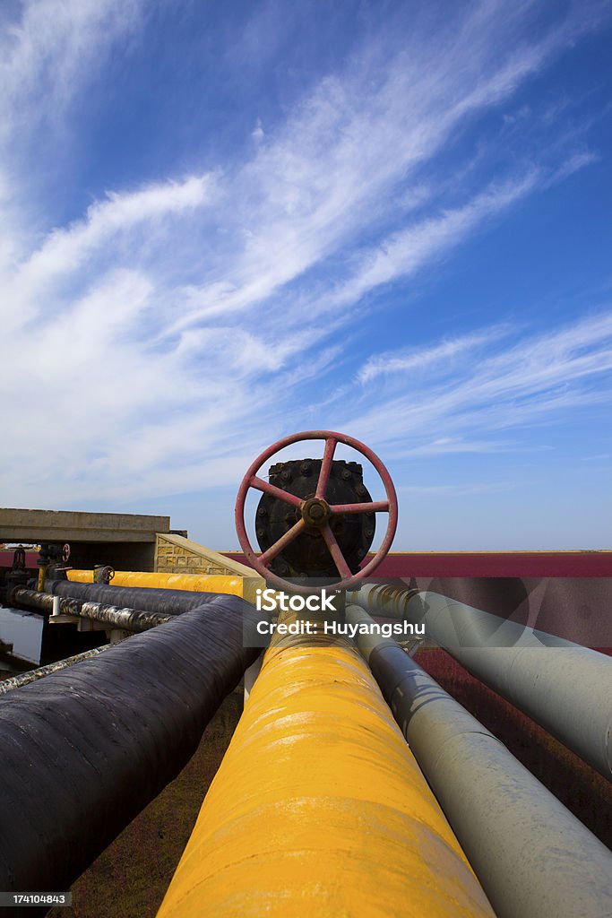 Oil Refinery Piping system Oil Refinery Piping system in contrast with a blue sky Blue Stock Photo