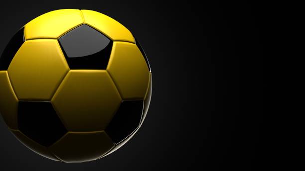 istock Yellow soccer ball on black text space. 1741054254