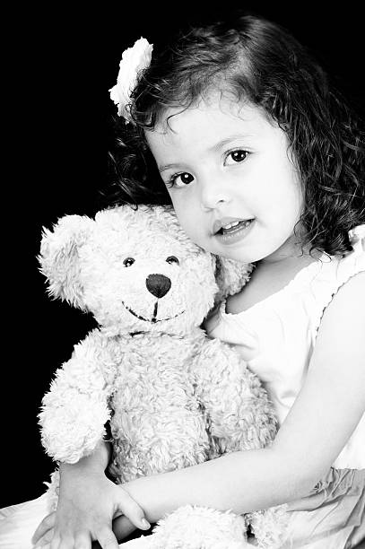 istock Cute Little Girl with Teddy Bear 174106205