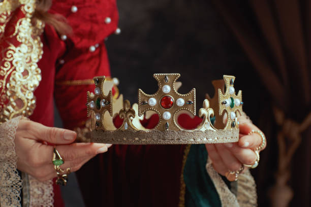 istock Closeup on medieval queen in red dress with crown 1741068600