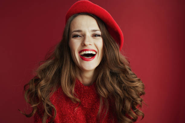 istock happy modern female in red sweater and beret 1741083792