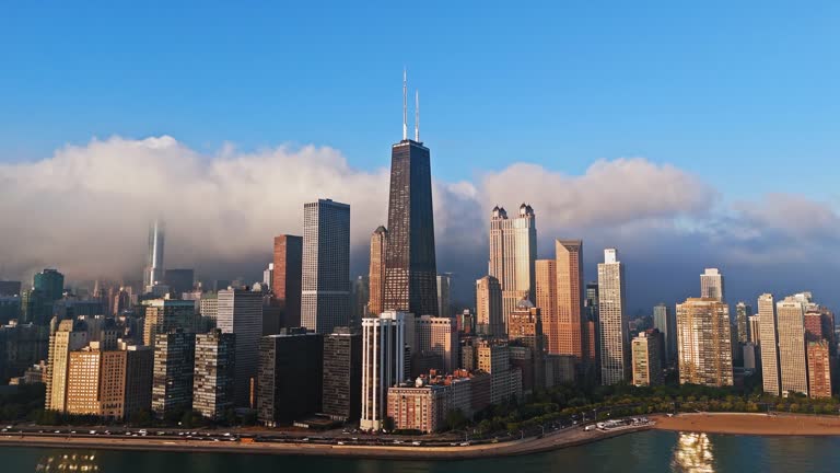 Aerial view circling lakefront skyscrapers in Streeterville, sunrise in Chicago