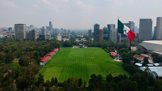 Aerial view of polo field with city in the background