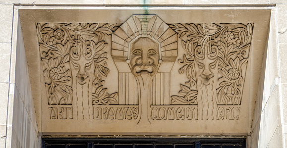 Art Deco bas-relief lintel recognizing art, drama, comedy and epic above door at 2 North Riverside Plaza (formerly called the Chicago Daily News buidling), Chicago, Illinois, USA. Sculpted by Alvin Meyer. Building opened in 1929.