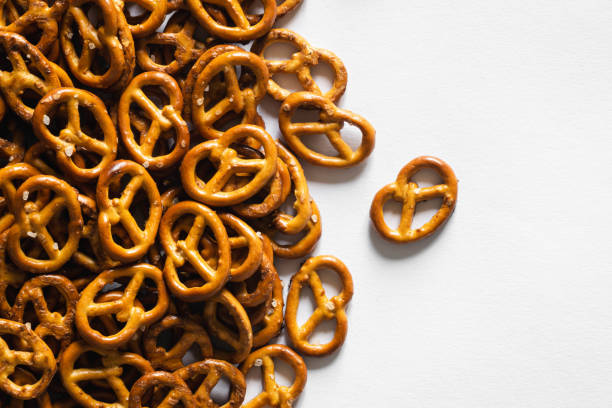 istock Salted mini pretzels on a white background, top view. 1741109240