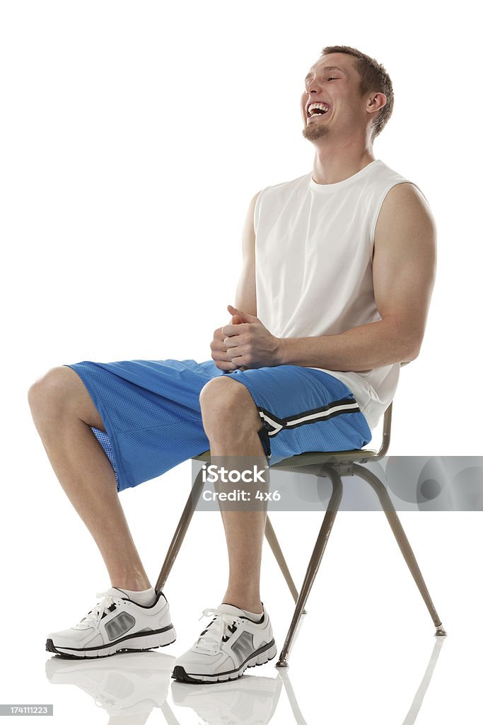Esportista, sentado em uma cadeira - Foto de stock de 20 Anos royalty-free
