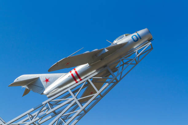Airplane - monument. Soviet plane with red star against blue sky..
