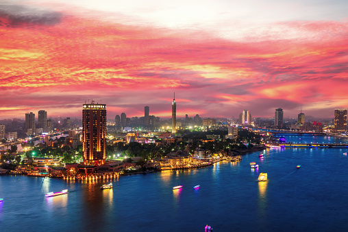 Incredible sunset over the Nile and night center of Cairo, Egypt.