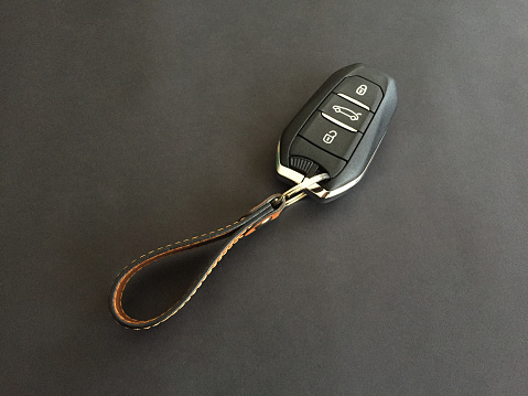 Car key on black background with copy space