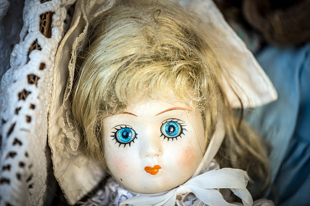 istock Scary antique doll and puppets in flea market 174113162