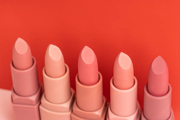 istock A row of different colors lipsticks on a red background 1741136042