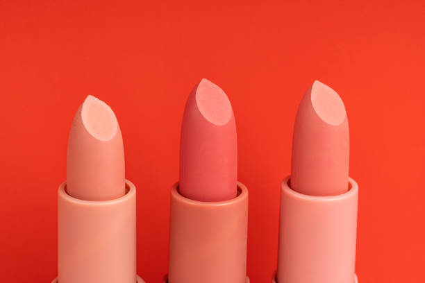 istock A row of different colors lipsticks on a red background 1741136554