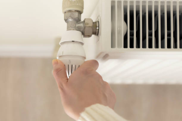 istock Temperature regulation in the home. Temperature control valve on a radiator. 1741166827