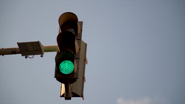 Traffic light with red light, changes to green light