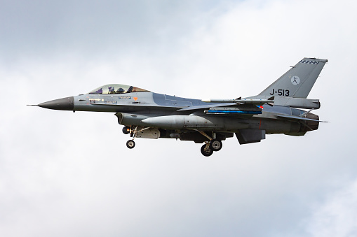 Leeuwarden / Netherlands - April 13, 2015: Royal Netherlands Air Force Lockheed Martin F-16AM Fighting Falcon J-513 fighter jet arrival and landing at Leeuwarden Air Base for Frisian Flag 2015 Air Exercise