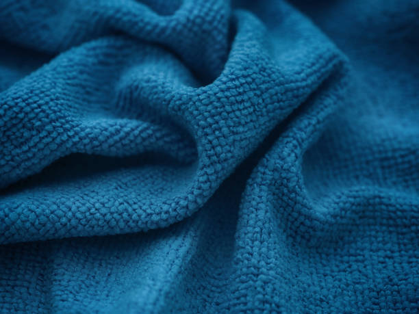 istock A dark blue microfiber cleaning towel texture background. Low key. 1741174763