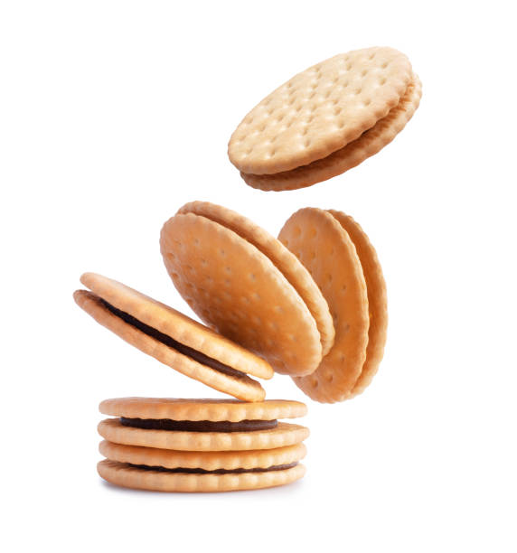 istock Crispy cookies with chocolate filling. Stack of crispy cookies isolated on a white background 1741187434